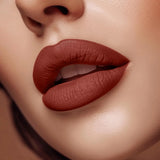 Close-up of lips wearing Swiss Miss Rich Mood B-107 matte lipstick shade.