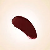Deep chocolate brown red texture swatch of Swiss Miss Rich Mood B-107 lipstick on a neutral background.
