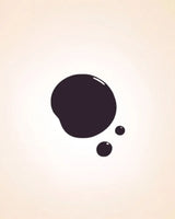 Glossy dark purple black liquid nail polish drop swatch in shade Satin 214 showing coverage and texture.
