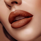 Close-up of lips wearing Swiss Miss Show Stopper B-114 matte lipstick shade.