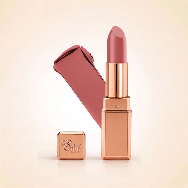 Swiss Miss Silk Lipstick in shade Almond Ice (705) in gold bullet packaging shown alongside a textured cream color swatch.