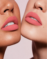 Close-up shot of two models with different skin tones wearing Swiss Miss Silk Lipstick in shade Base Pink (713).