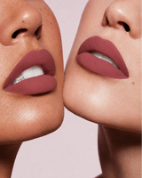Close-up shot of two models with different skin tones wearing Swiss Miss Silk Lipstick in shade Belgian Spice (708).