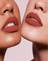 Close-up shot of two models with different skin tones wearing Swiss Miss Silk Lipstick in shade Birkin Brown (707).