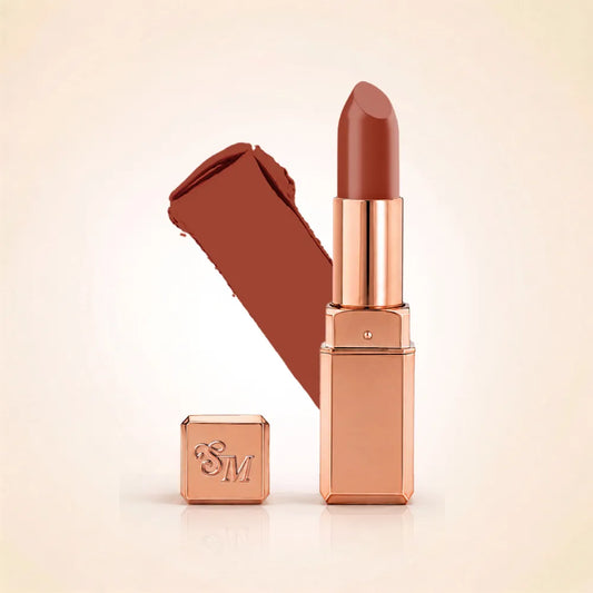 Swiss Miss Silk Lipstick in shade Birkin Brown (707) in gold bullet packaging shown alongside a textured cream color swatch.