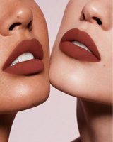 Close-up shot of two models with different skin tones wearing Swiss Miss Silk Lipstick in shade Blushing Babe (733).