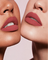 Close-up shot of two models with different skin tones wearing Swiss Miss Silk Lipstick in shade Candy Crush (716).