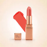 Swiss Miss Silk Lipstick in shade Coral Ice (727) in gold bullet packaging shown alongside a textured cream color swatch.