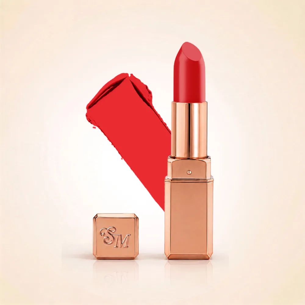 Swiss Miss Silk Lipstick in shade Coral Pink (726) in gold bullet packaging shown alongside a textured cream color swatch.