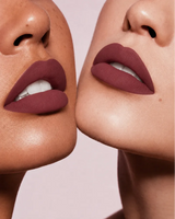 Close-up shot of two models with different skin tones wearing Swiss Miss Silk Lipstick in shade Deep Cherry (710).