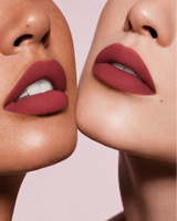 Close-up shot of two models with different skin tones wearing Swiss Miss Silk Lipstick in shade Deep Scarlet (718).