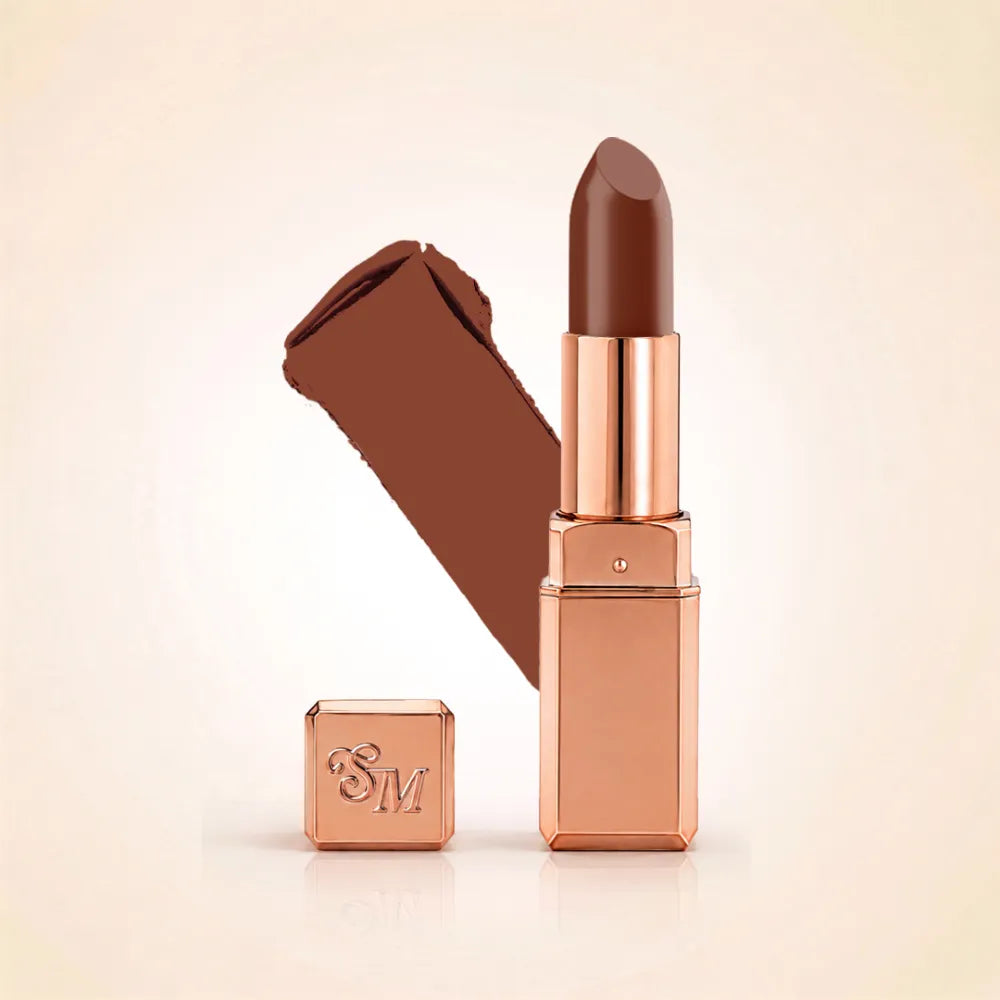 Swiss Miss Silk Lipstick in shade Espresso (730) in gold bullet packaging shown alongside a textured cream color swatch.
