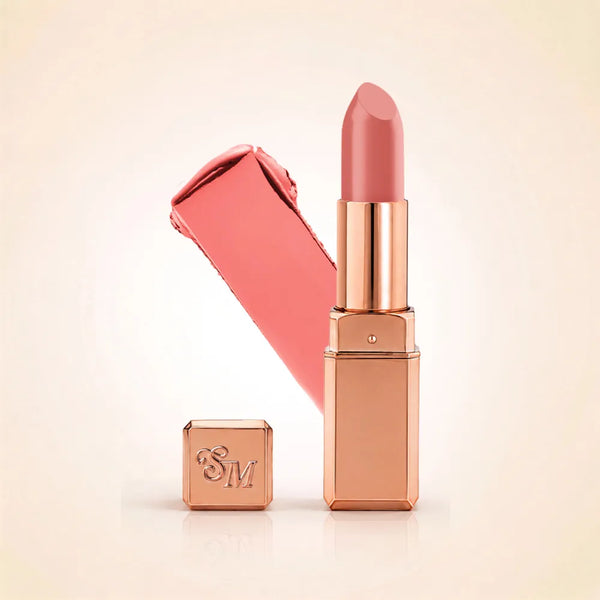 Swiss Miss Silk Lipstick in shade Honey Pink (702) in gold bullet packaging shown alongside a textured cream color swatch.