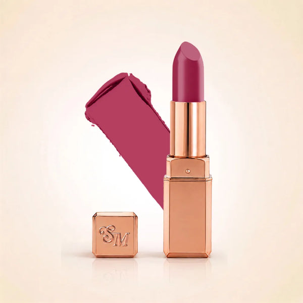Swiss Miss Silk Lipstick in shade Orchid Dream (724) in gold bullet packaging shown alongside a textured cream color swatch.