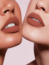 Close-up shot of two models with different skin tones wearing Swiss Miss Silk Lipstick in shade Pillow Kiss (732).
