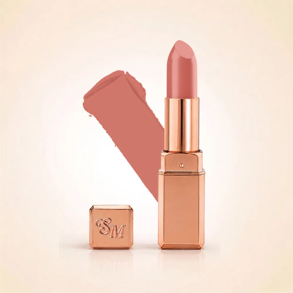 Swiss Miss Silk Lipstick in shade Rose Taupe (706) in gold bullet packaging shown alongside a textured cream color swatch.