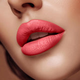 Close-up of lips wearing Swiss Miss Soar Pink B-108 matte lipstick shade.