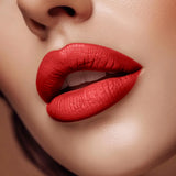 Close-up of lips wearing Swiss Miss Velvet Sin B-110 matte red lipstick shade.