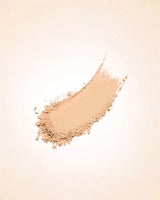 Smudged powder streak swatch demonstrating the fine texture and warm ivory shade coverage of Swiss Miss Compact Powder in Fine Ivory SM 02