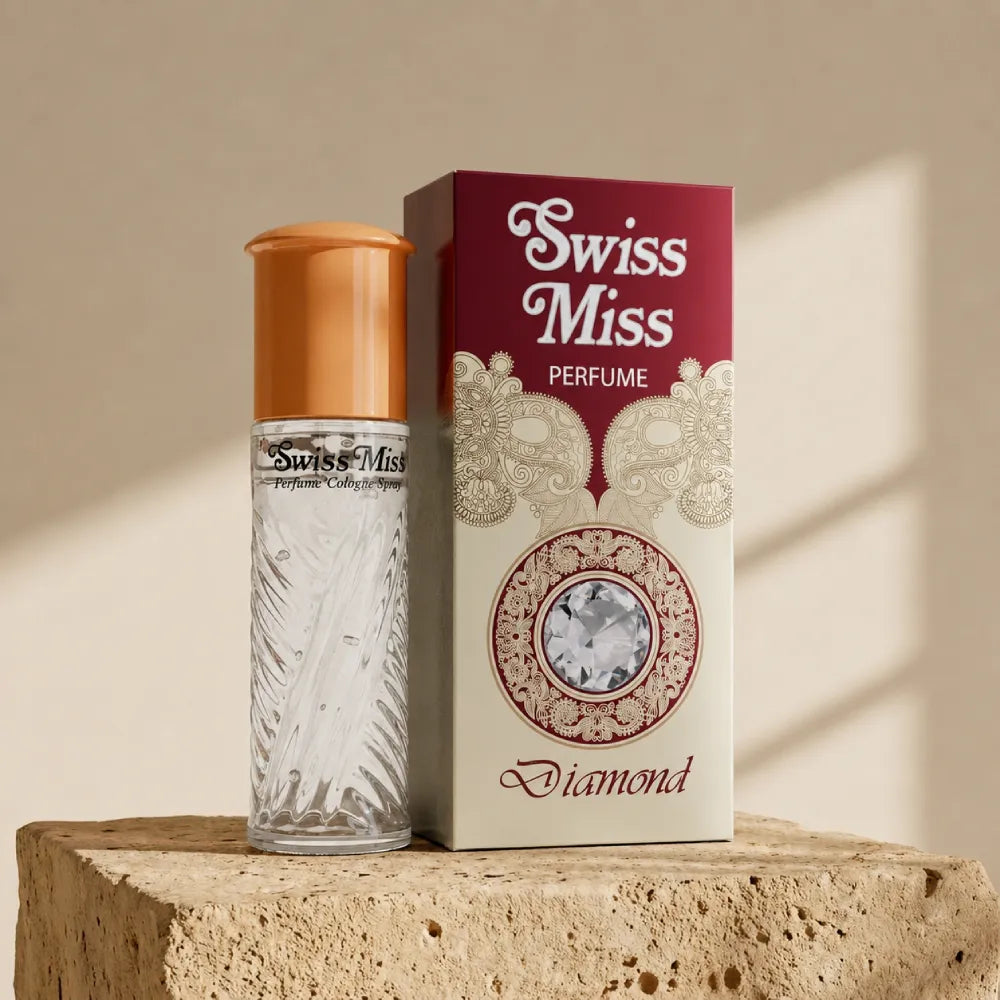 Swiss Miss Diamond Perfume 15ml textured glass bottle with gold cap next to maroon and cream box on a stone pedestal
