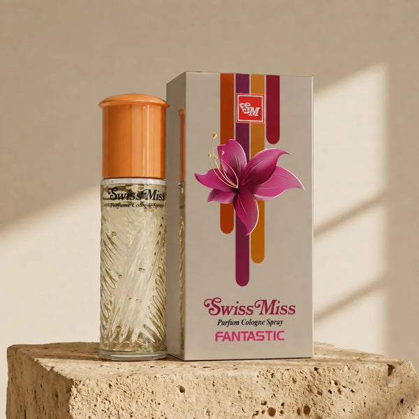 Swiss Miss Fantastic Perfume 15ml textured glass bottle with gold cap beside a grey floral packaging box on a stone pedestal