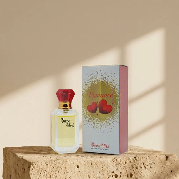 Swiss Miss Romance Perfume 15ml bottle and packaging box with red heart design on a stone pedestal